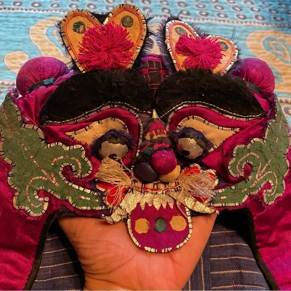 Antique vintage Asian child’s embroidered hat. Festival celebration festival